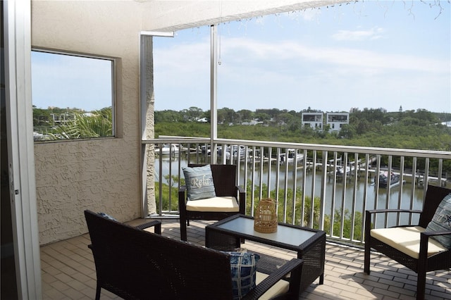 balcony featuring a water view