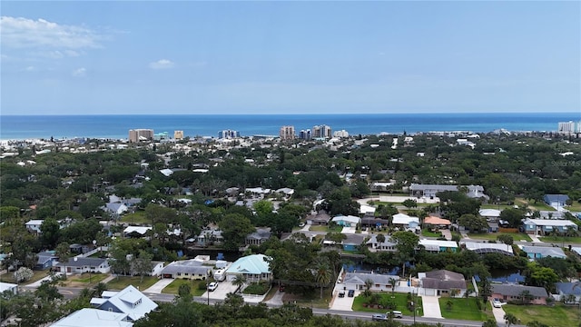 birds eye view of property featuring a water view and a residential view