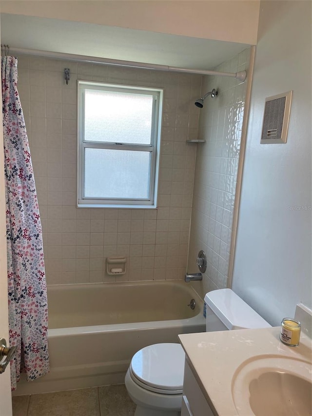 full bath with shower / bath combo with shower curtain, toilet, visible vents, and tile patterned flooring