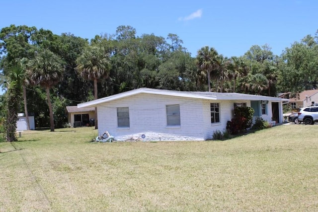 1830 Needle Palm Dr, Edgewater, FL 32132 - view of home's exterior featuring a lawn