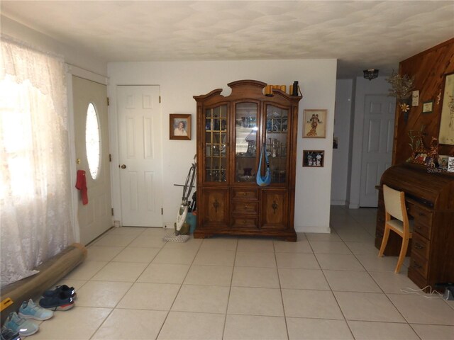 foyer featuring light tile patterned flooring