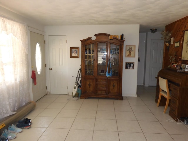 1627 Umbrella Tree Dr, Edgewater, FL 32132 - foyer featuring light tile patterned flooring
