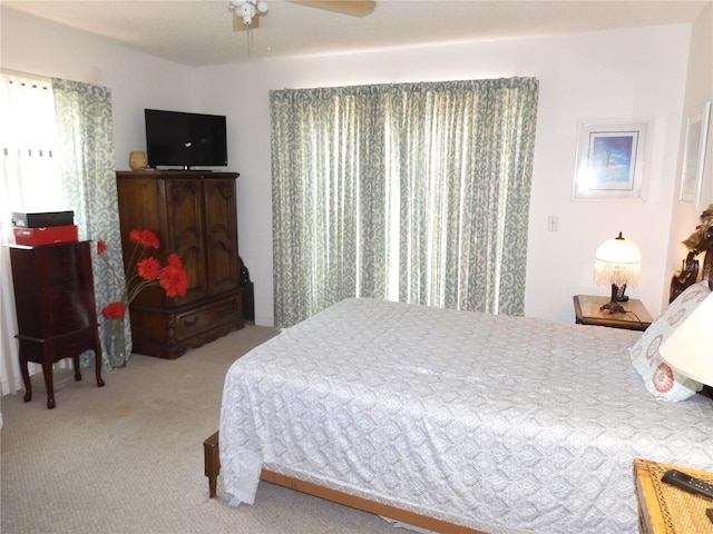 bedroom with carpet flooring and a ceiling fan
