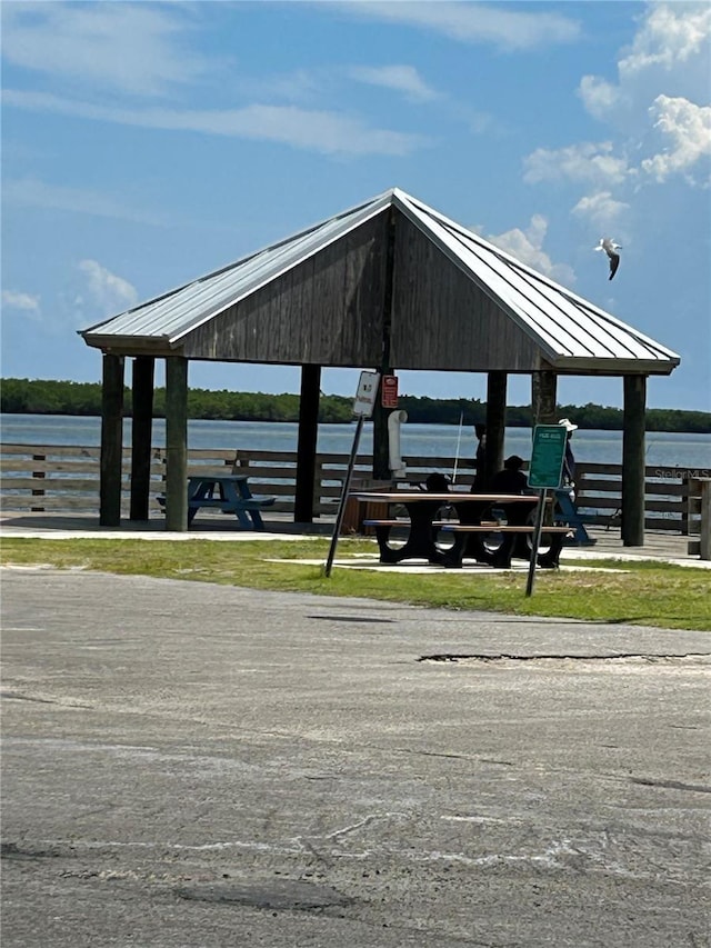 view of community with a water view and a gazebo