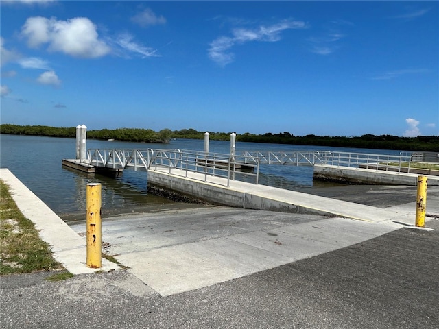 dock area featuring a boat ramp and a water view
