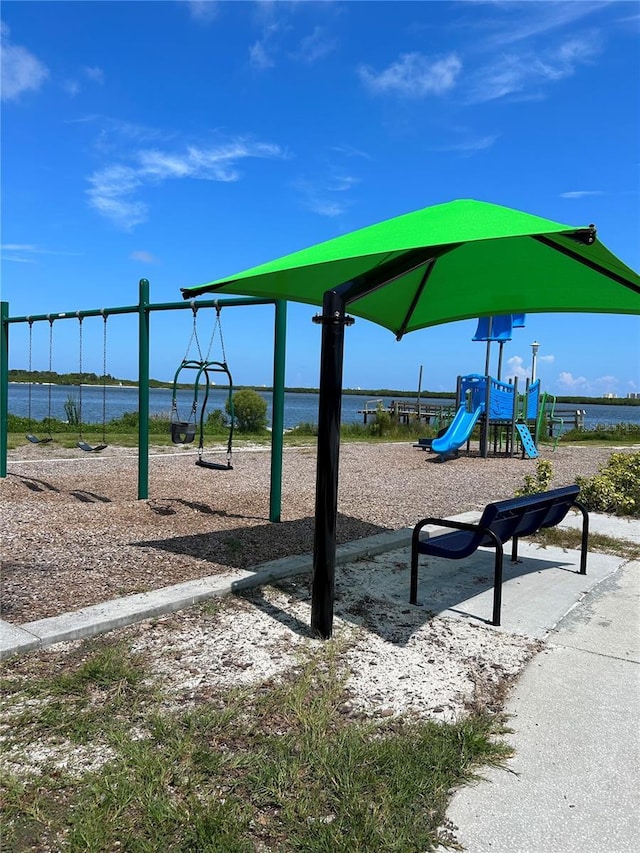 communal playground featuring a water view