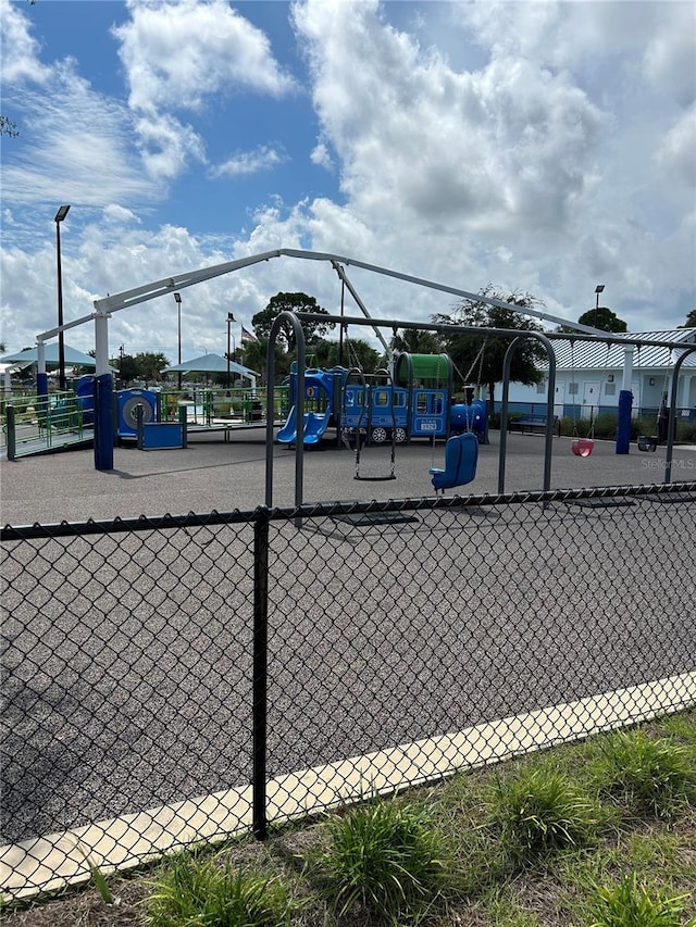 community jungle gym with fence