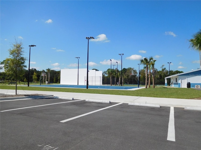 uncovered parking lot featuring community basketball court