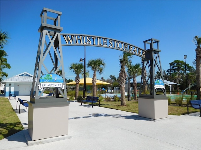 view of home's community featuring fence