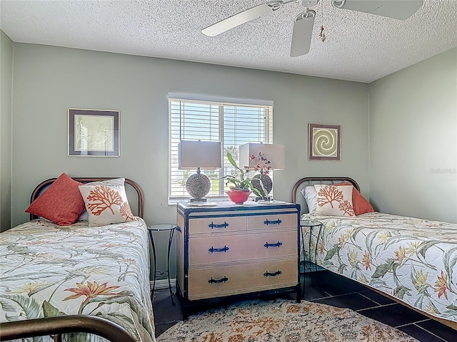 31 Sea Harbor Dr E, Ormond Beach, FL 32176 - tiled bedroom featuring ceiling fan and a textured ceiling