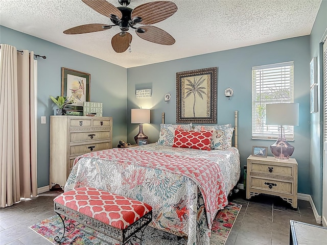 31 Sea Harbor Dr E, Ormond Beach, FL 32176 - bedroom with a textured ceiling, baseboards, and ceiling fan