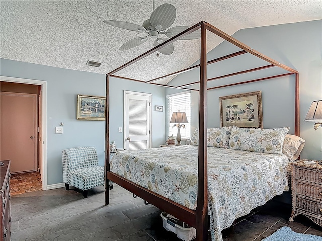 31 Sea Harbor Dr E, Ormond Beach, FL 32176 - bedroom with lofted ceiling, a textured ceiling, ceiling fan, a closet, and baseboards