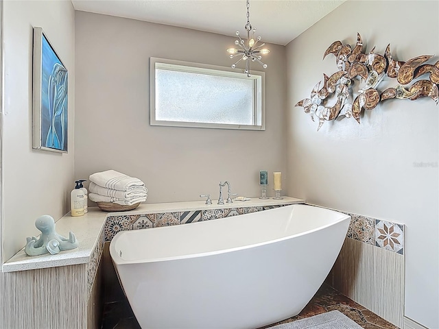 31 Sea Harbor Dr E, Ormond Beach, FL 32176 - bathroom featuring a freestanding tub and a chandelier