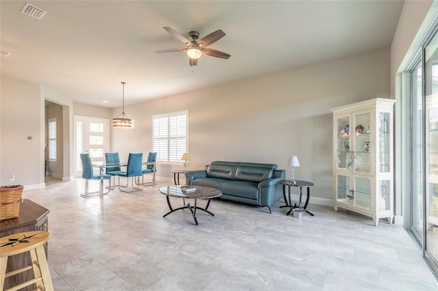6456 Roseberry Ct, Port Orange, FL 32128 - living area with baseboards and ceiling fan