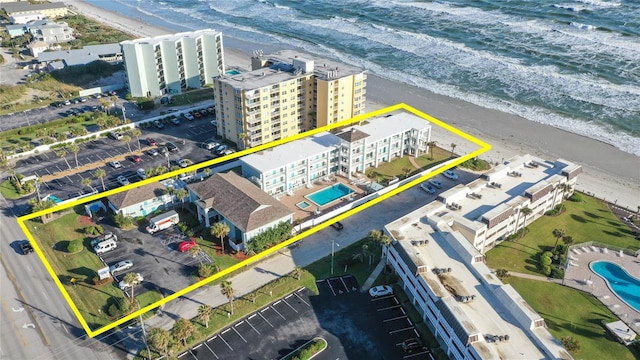 3509 S Atlantic Ave Unit 102And 103, New Smyrna Beach, FL 32169 - aerial overview of property's location with property boundaries highlighted, expansive beach, a pool area, and apartment complex