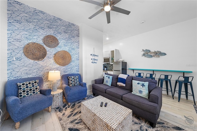 3509 S Atlantic Ave Unit 102And 103, New Smyrna Beach, FL 32169 - living room with wood finished floors, a ceiling fan, and baseboards