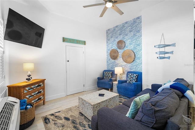 3509 S Atlantic Ave Unit 102And 103, New Smyrna Beach, FL 32169 - living area with a ceiling fan, light wood-style floors, baseboards, and heating unit