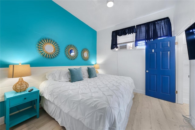 3509 S Atlantic Ave Unit 102And 103, New Smyrna Beach, FL 32169 - bedroom featuring wood finished floors and lofted ceiling