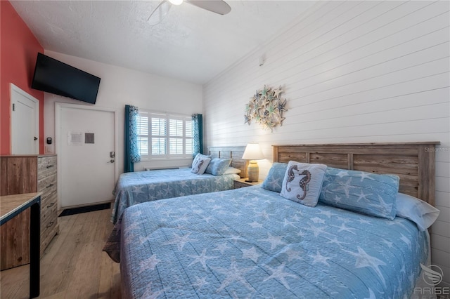 3509 S Atlantic Ave Unit 102And 103, New Smyrna Beach, FL 32169 - bedroom featuring wood finished floors and ceiling fan