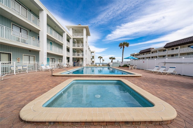 3509 S Atlantic Ave Unit 102And 103, New Smyrna Beach, FL 32169 - community pool with fence and a patio