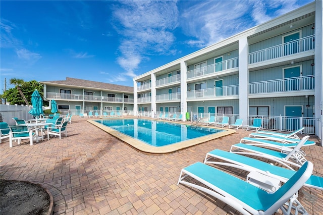 3509 S Atlantic Ave Unit 102And 103, New Smyrna Beach, FL 32169 - community pool with a patio area and fence