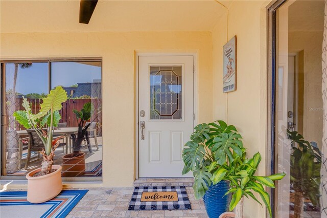 property entrance featuring stucco siding