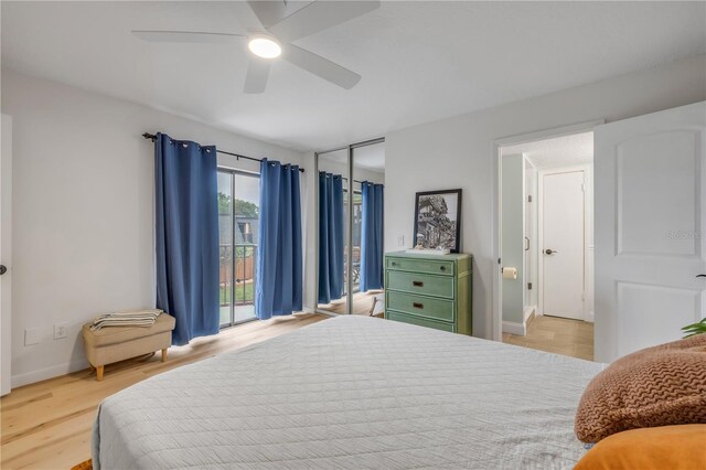 bedroom with wood finished floors, baseboards, ceiling fan, and access to exterior