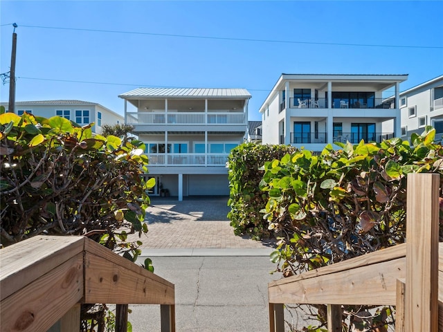 exterior space with decorative driveway and a garage