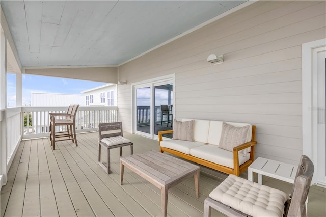 wooden terrace featuring outdoor lounge area