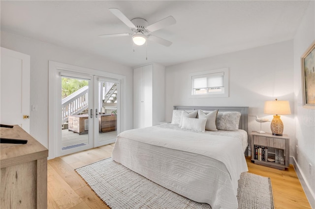 bedroom with access to outside, french doors, light wood-style floors, and baseboards