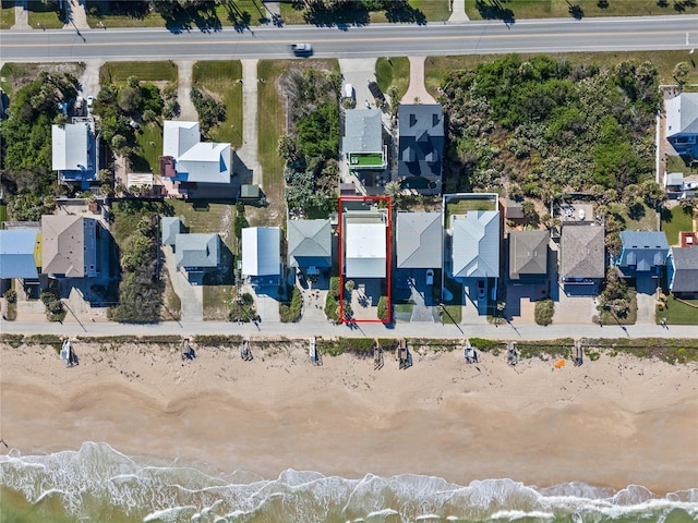 aerial view of residential area featuring a nearby body of water