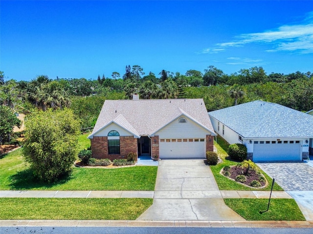 ranch-style house featuring a front lawn, concrete driveway, a garage, and brick siding