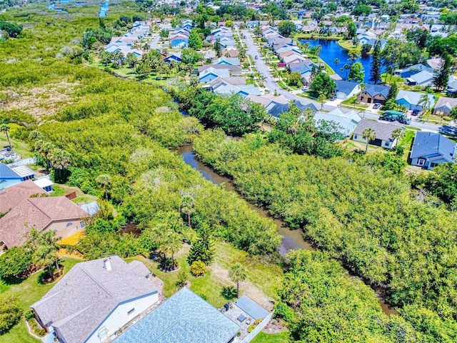 aerial view of residential area with a large body of water