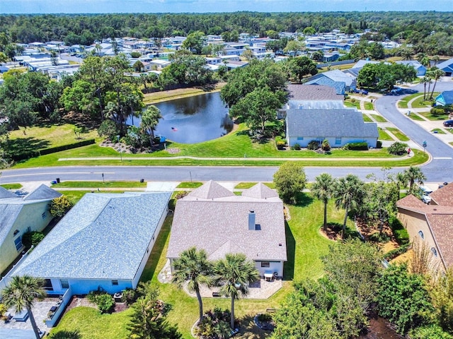 aerial view of residential area with a large body of water
