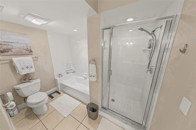 full bathroom with toilet, a stall shower, tile patterned flooring, and a garden tub