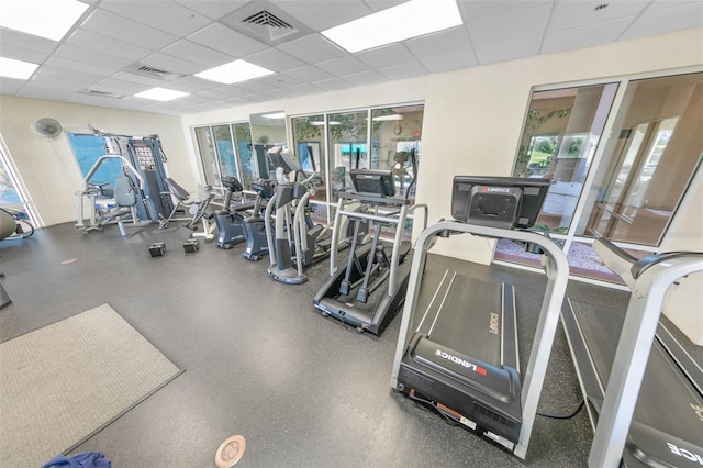 workout area with a drop ceiling