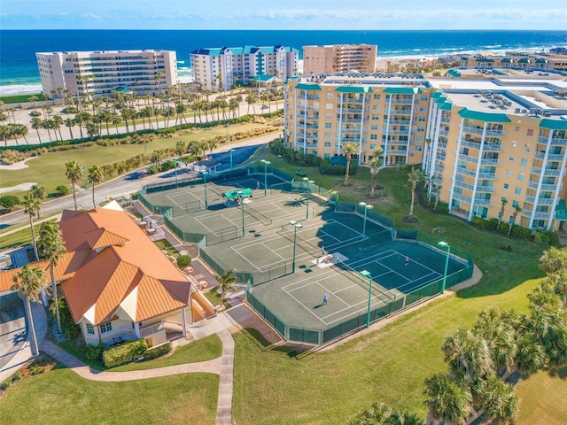 bird's eye view of a large body of water and apartment complex / building