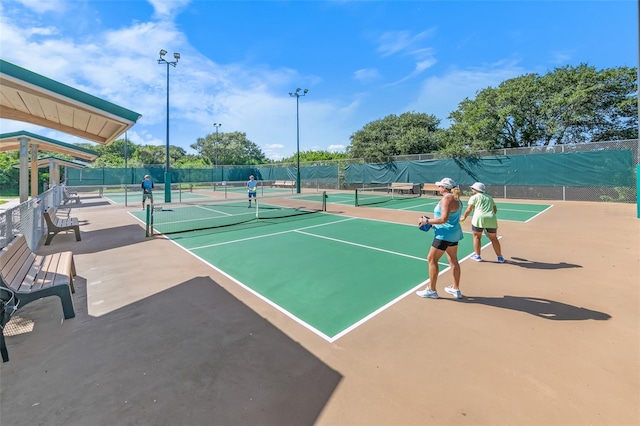 view of tennis court with fence