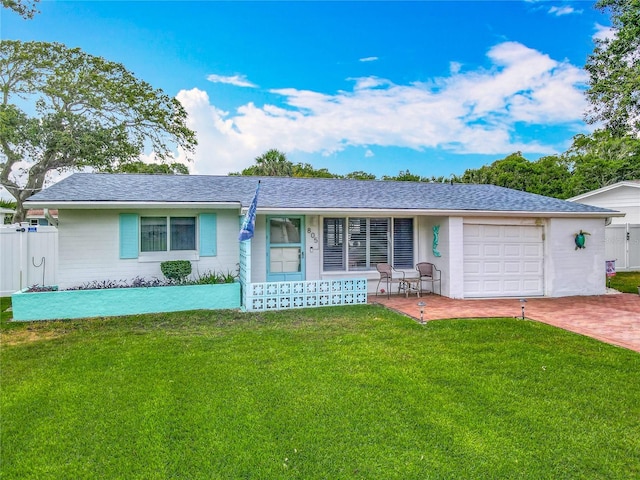 single story home featuring an attached garage, decorative driveway, and a porch