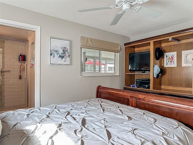 bedroom featuring a textured ceiling and a ceiling fan
