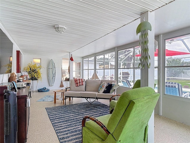 sunroom / solarium with speckled floor