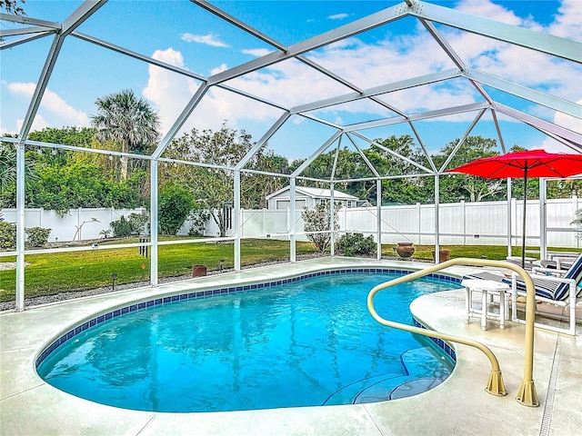 view of pool featuring a patio area and glass enclosure