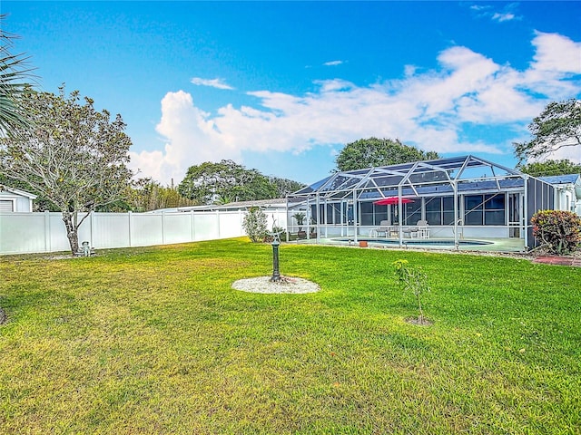 view of yard featuring an outdoor pool and a lanai