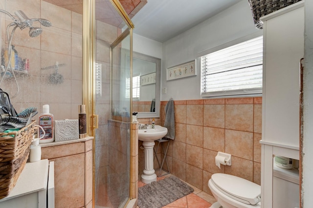 184 Azalea Rd, Edgewater, FL 32141 - full bathroom featuring tile walls, a shower stall, toilet, and tile patterned floors