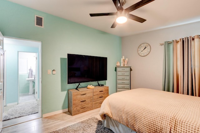 184 Azalea Rd, Edgewater, FL 32141 - bedroom with light wood-type flooring, ceiling fan, baseboards, and connected bathroom