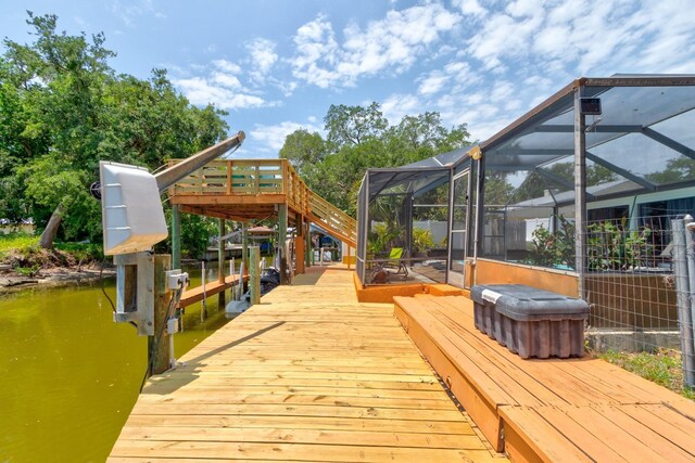 184 Azalea Rd, Edgewater, FL 32141 - wooden terrace with a boat dock, a lanai, boat lift, and a water view