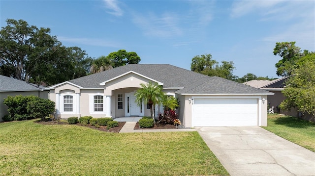 404 Central Mariners Dr, Edgewater, FL 32141 - ranch-style home with an attached garage, roof with shingles, stucco siding, and a front yard