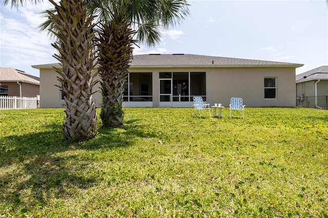 404 Central Mariners Dr, Edgewater, FL 32141 - rear view of house with stucco siding and a sunroom