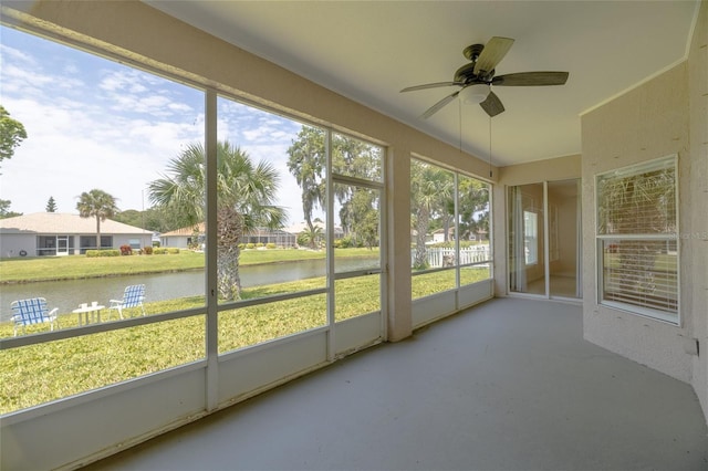 404 Central Mariners Dr, Edgewater, FL 32141 - unfurnished sunroom featuring a water view, a ceiling fan, and a residential view