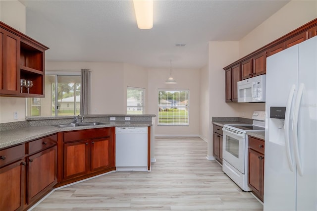 404 Central Mariners Dr, Edgewater, FL 32141 - kitchen featuring white appliances, a sink, light wood finished floors, a peninsula, and open shelves